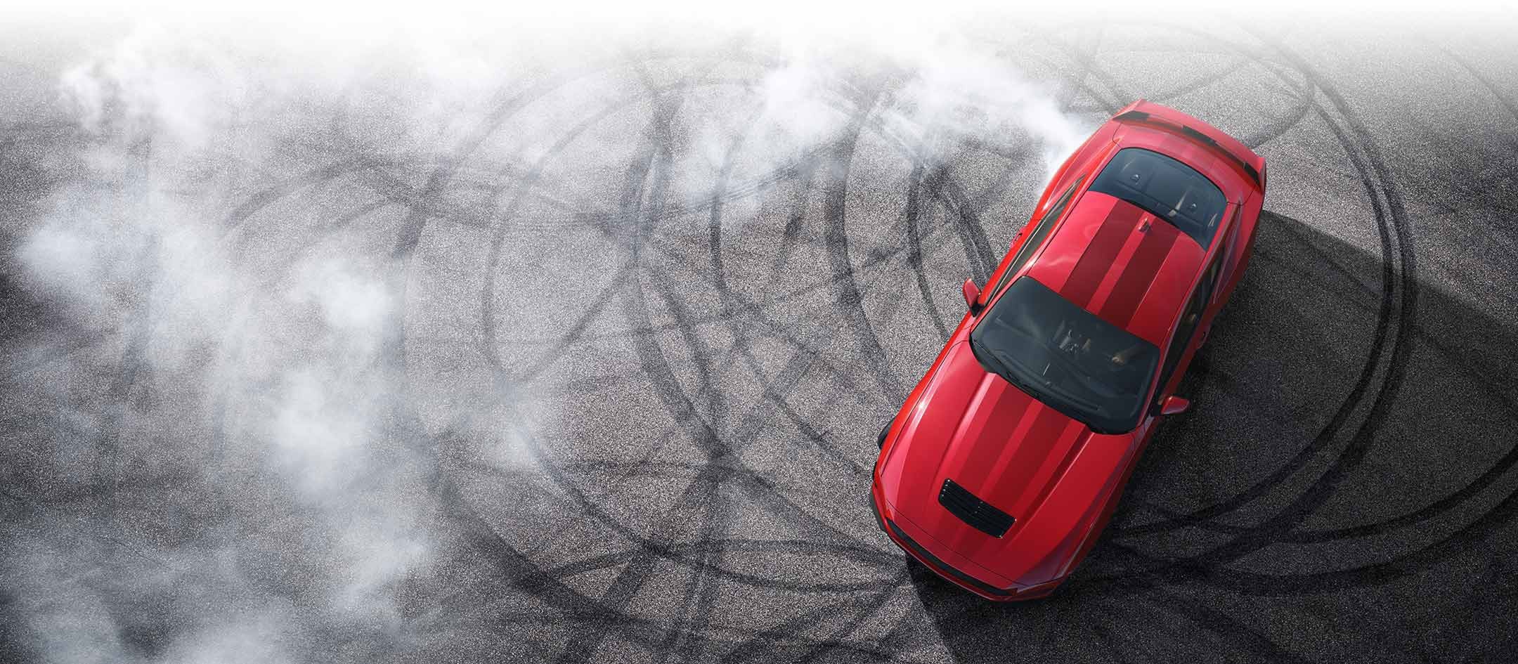 Overhead view of a 2024 Ford Mustang® model with tire tracks on pavement | Conroy Motor Corporation in Java Center NY
