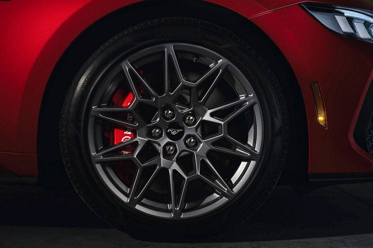 2024 Ford Mustang® model with a close-up of a wheel and brake caliper | Conroy Motor Corporation in Java Center NY