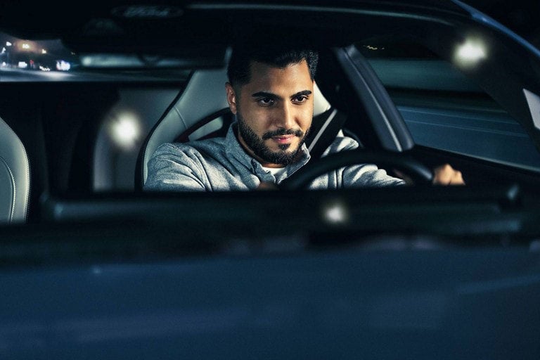 Person sitting in the driver’s seat of a parked 2024 Ford Mustang® coupe | Conroy Motor Corporation in Java Center NY
