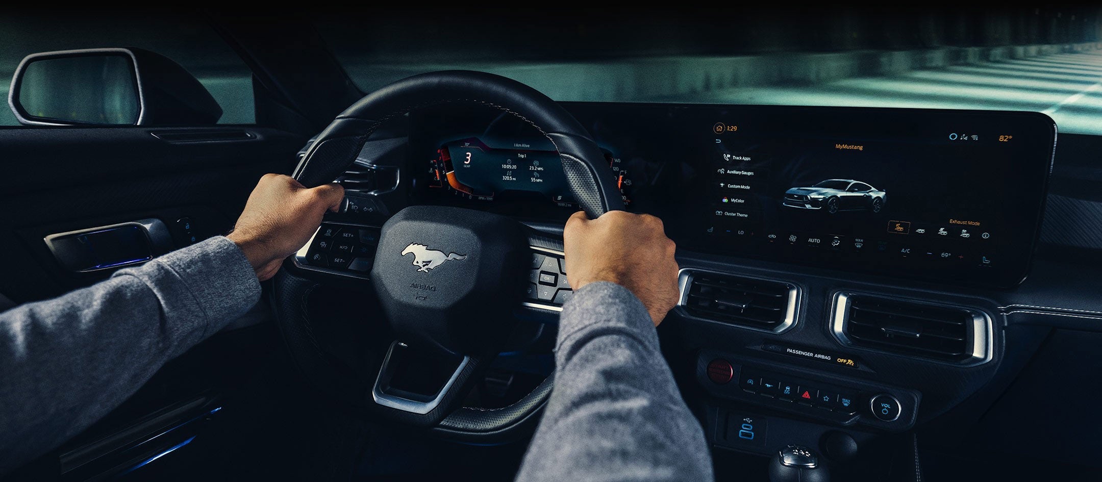 A 2024 Ford Mustang® model interior with a person driving | Conroy Motor Corporation in Java Center NY