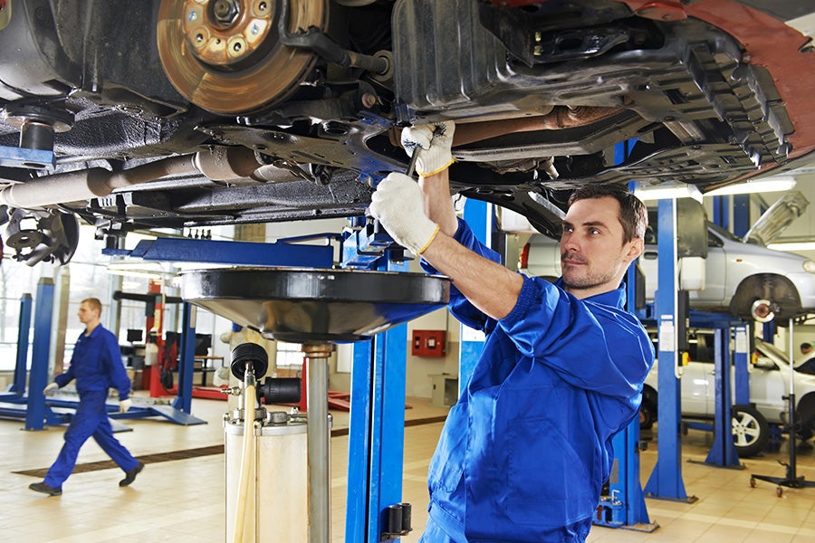 Mechanic working under a car